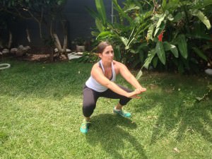 fitness plan for beginners: trainer squatting